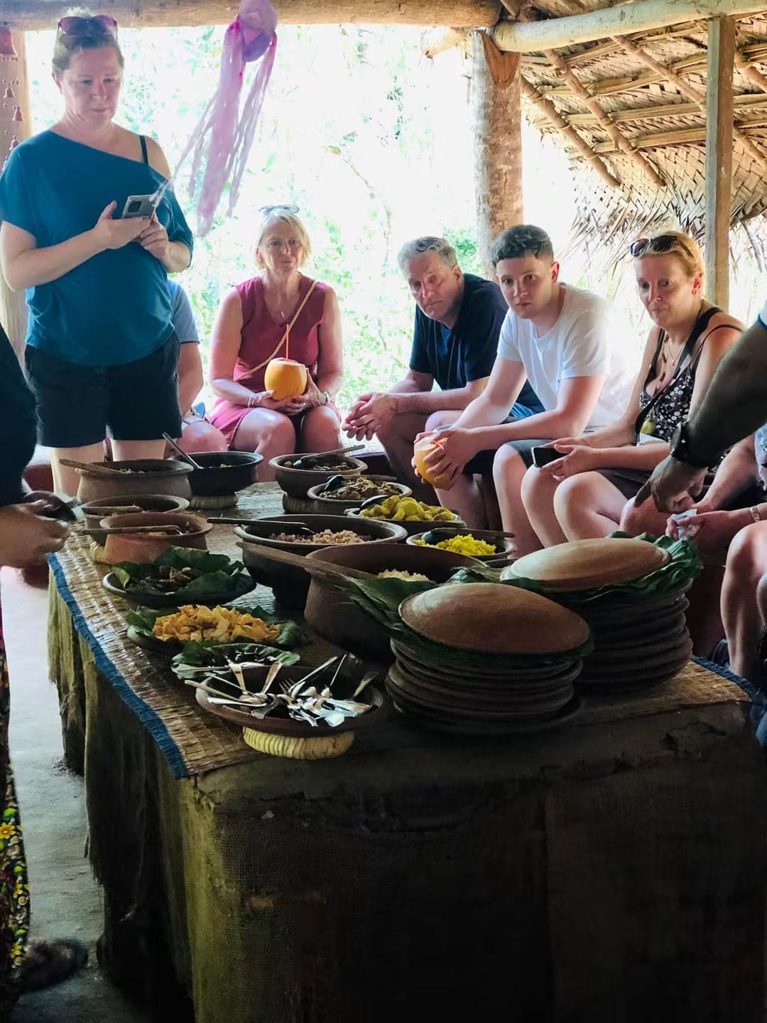 Village lunch table with clay pots and banana-leaf plates